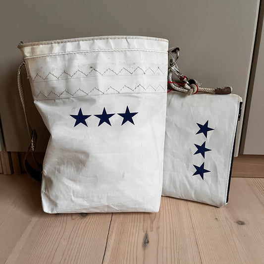 Skulderveske med tre sjerner og clutch