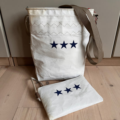 Skulderveske med tre sjerner og clutch