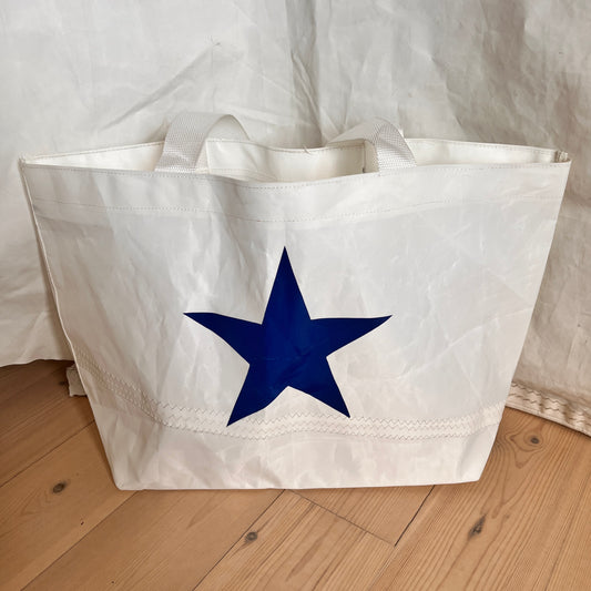 Stor bag med blå stjerne i midten